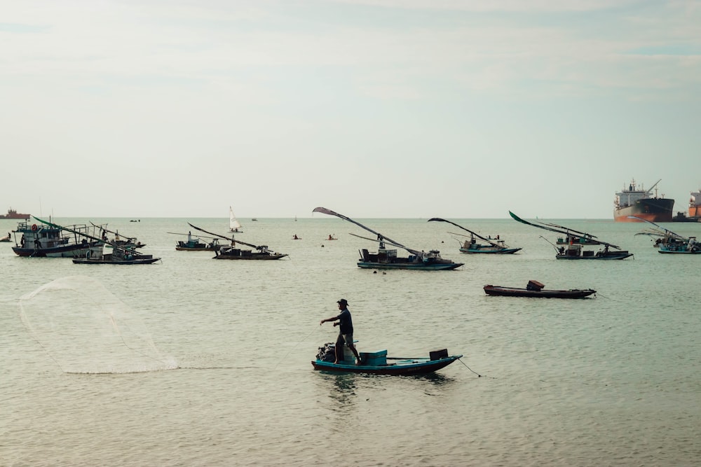 a group of boats floating on top of a large body of water