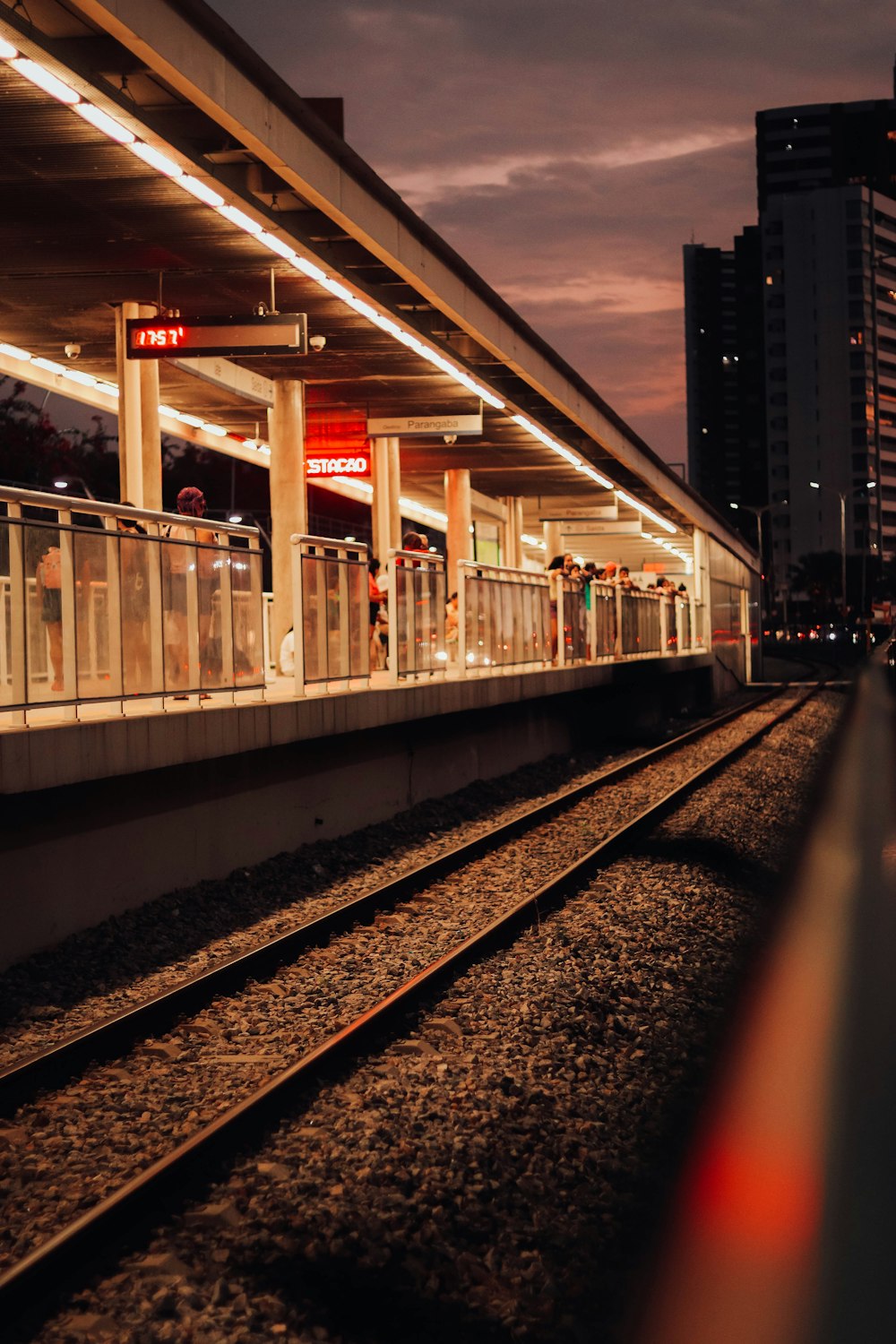 a train station with a train on the tracks