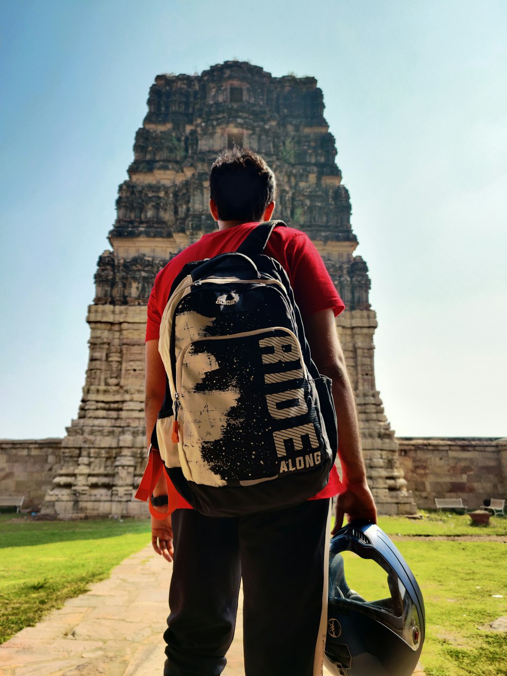 a person with a helmet and a backpack