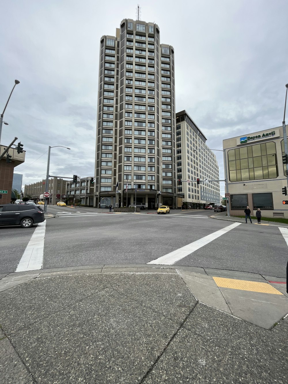 a tall building sitting on the corner of a street