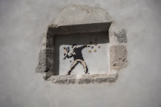 Close-up of Banksy's stencil showing a protester throwing flowers instead of a Molotov cocktail