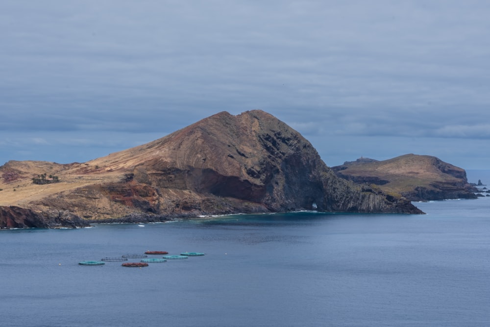 a group of boats floating on top of a large body of water