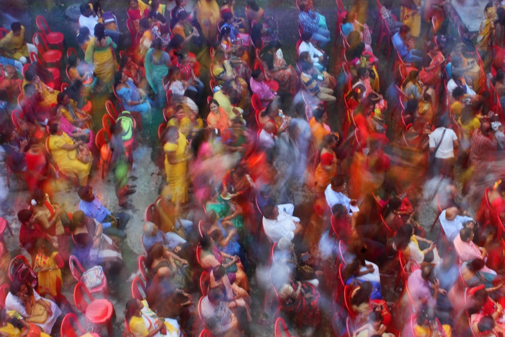 a large group of people are dancing in the street