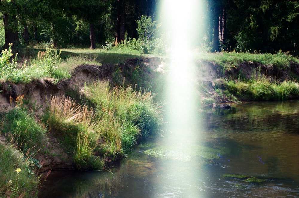 a bright beam of light shines into the water