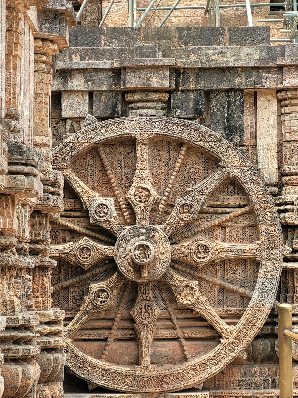a large wheel on the side of a building