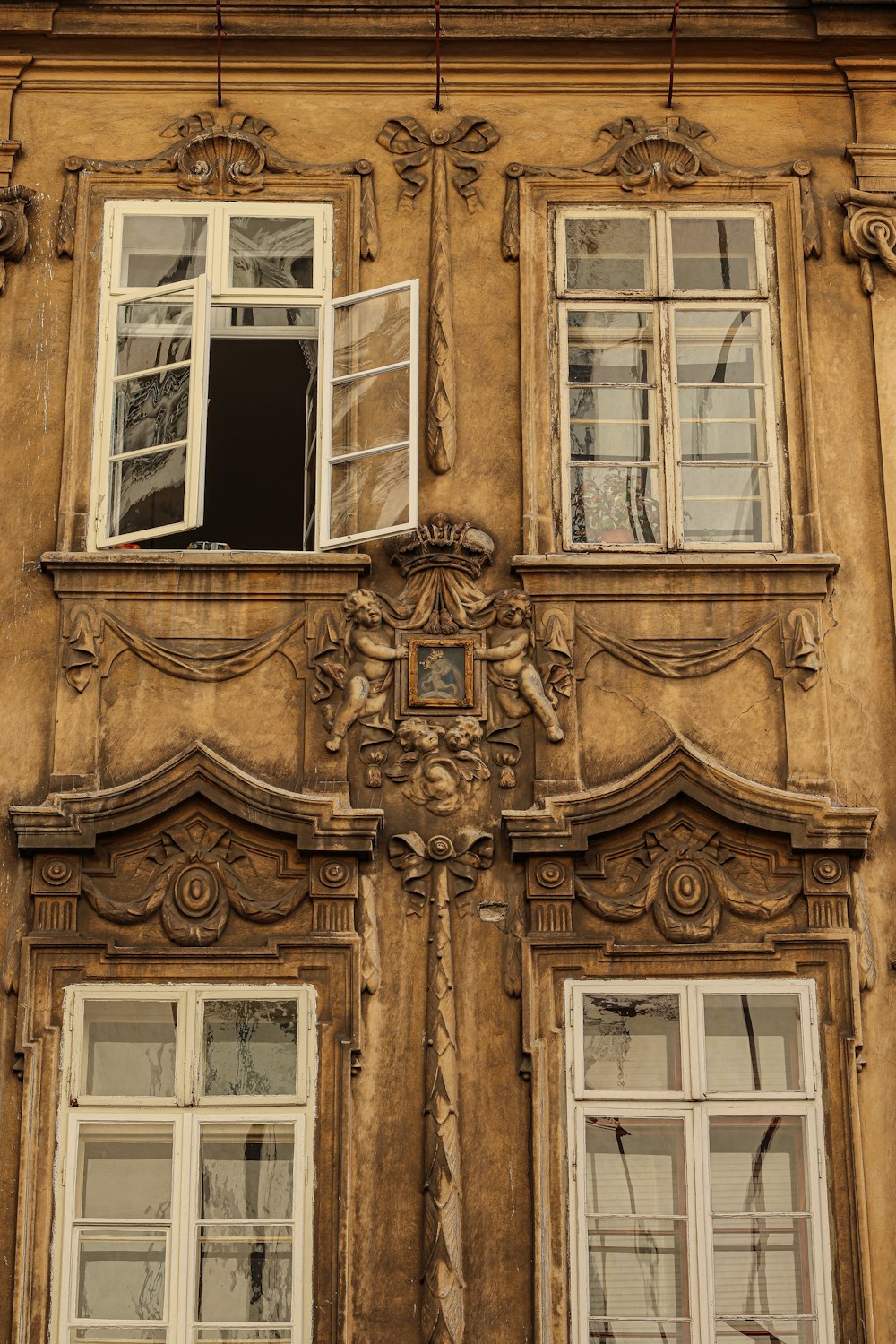 an old building with a clock on the front of it