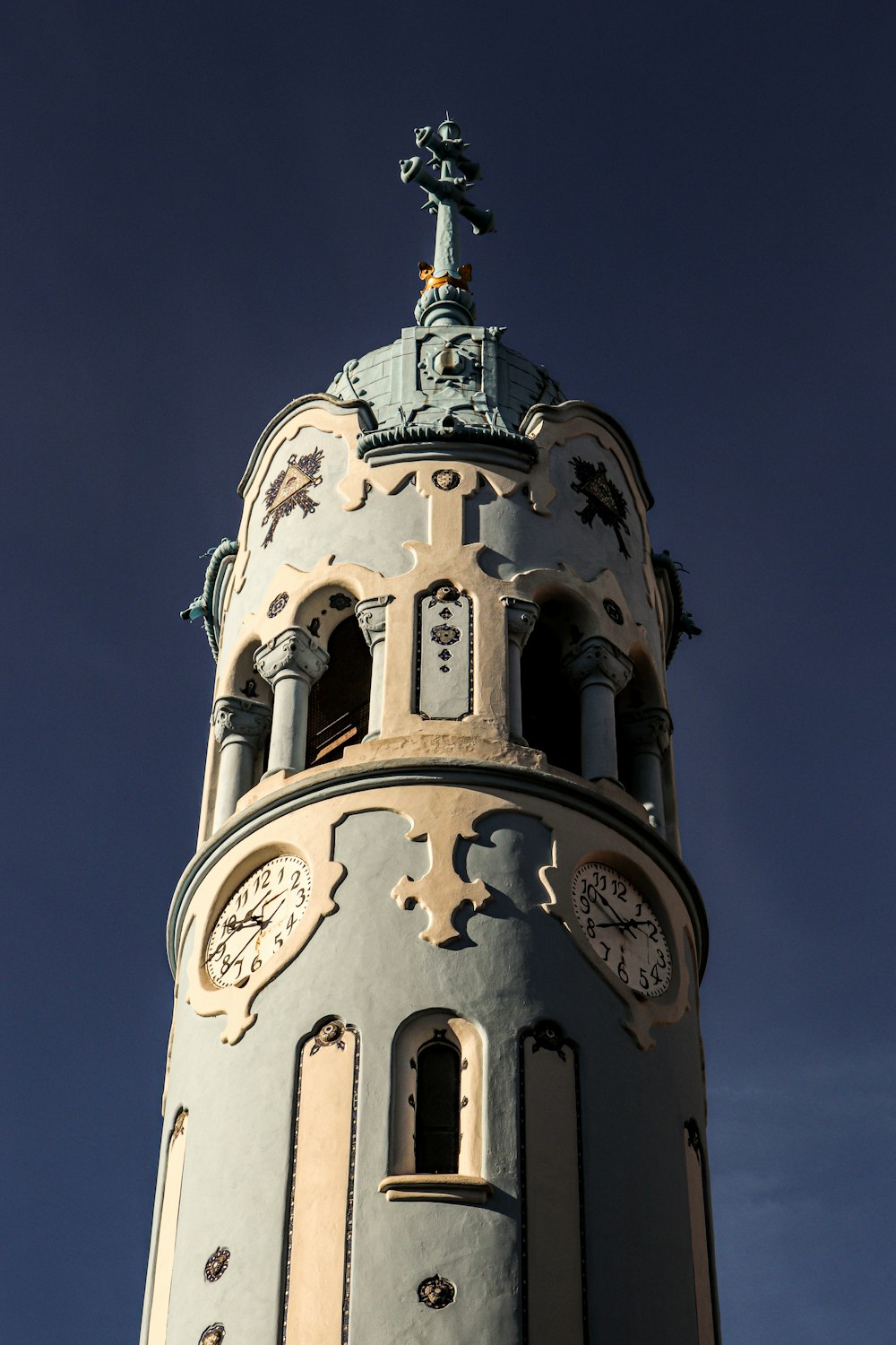 a tall tower with clocks on each of it's sides