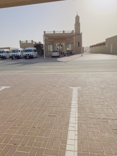 Volunteers and community members working together to build a small Quran learning house.