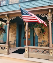 Charming front porch with natural wood accents and potted plants welcoming guests.