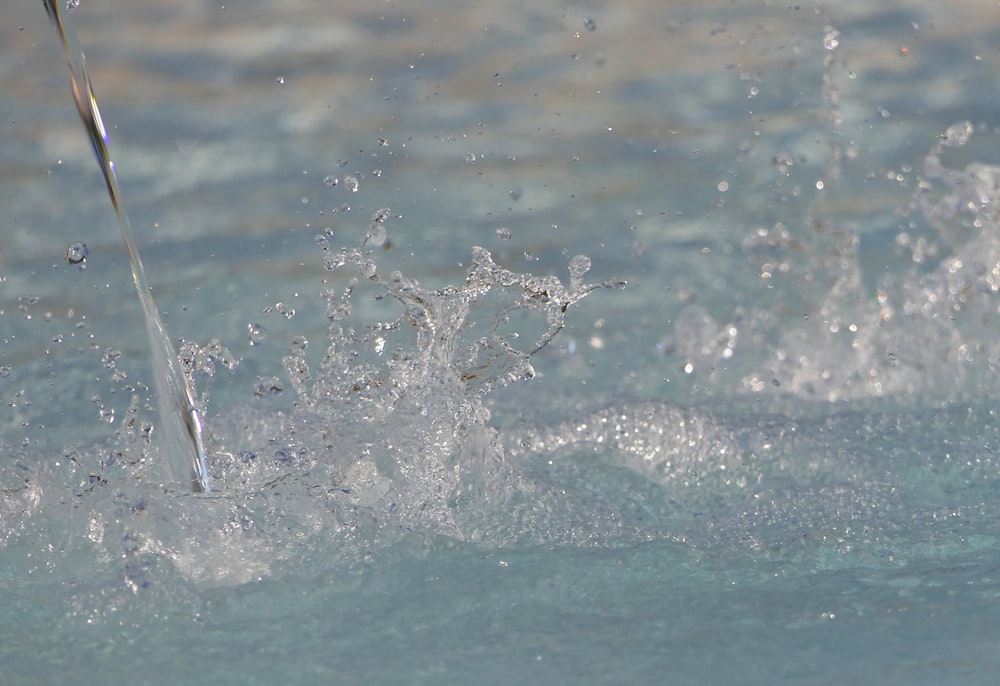 a close up of a water spout in the water