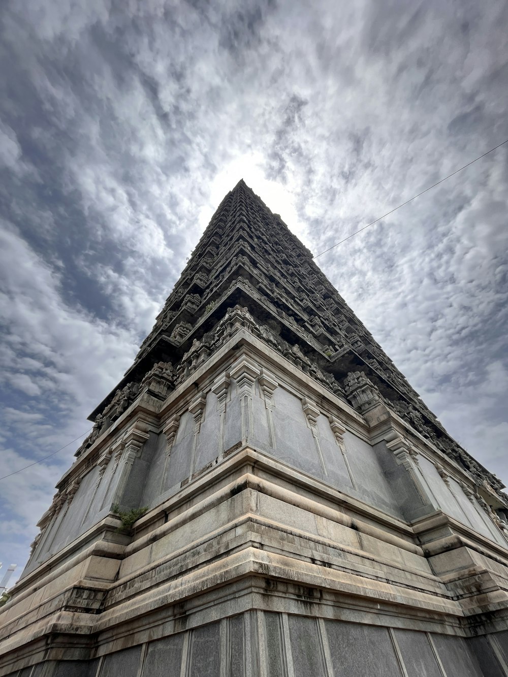 a very tall building with a sky in the background