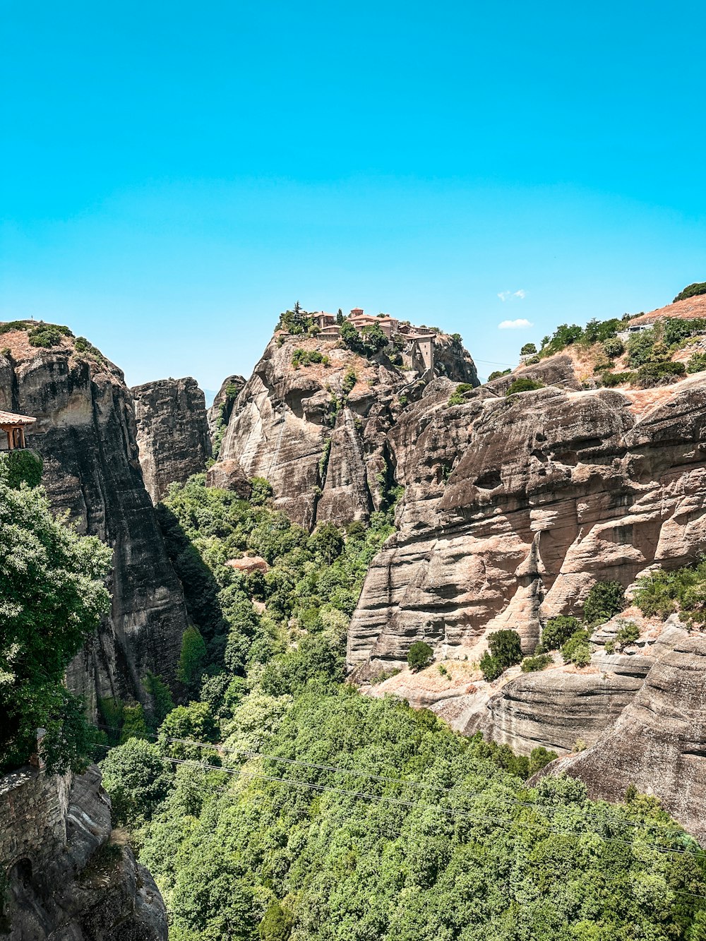 a scenic view of a mountain with trees in the foreground