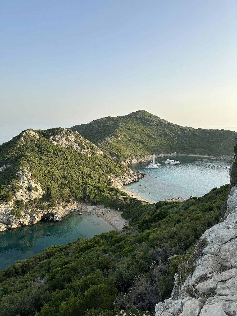 a scenic view of a body of water surrounded by mountains