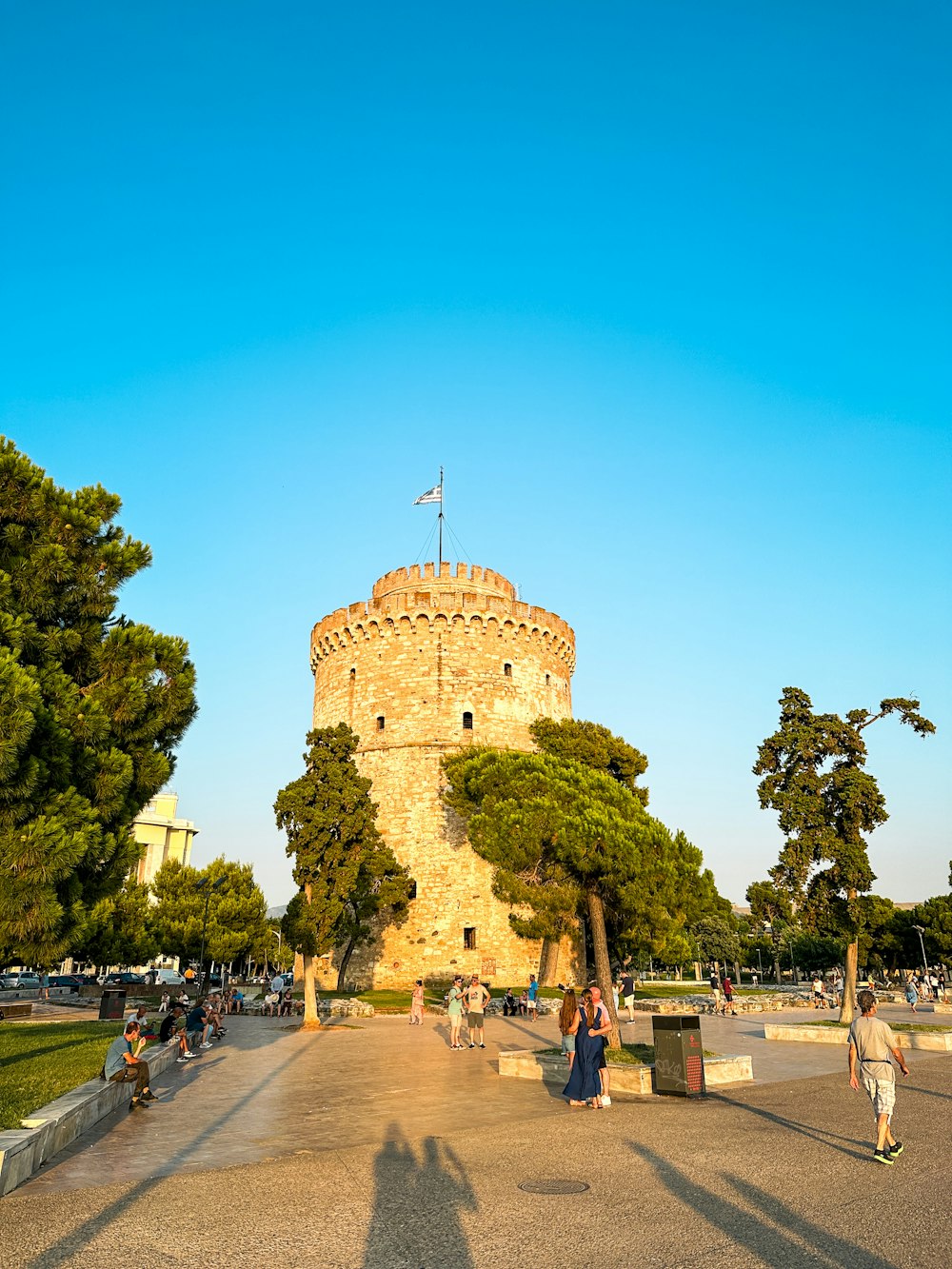 a large tower with a flag on top of it