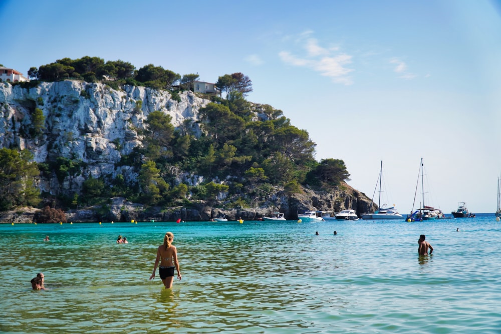 a group of people swimming in a body of water