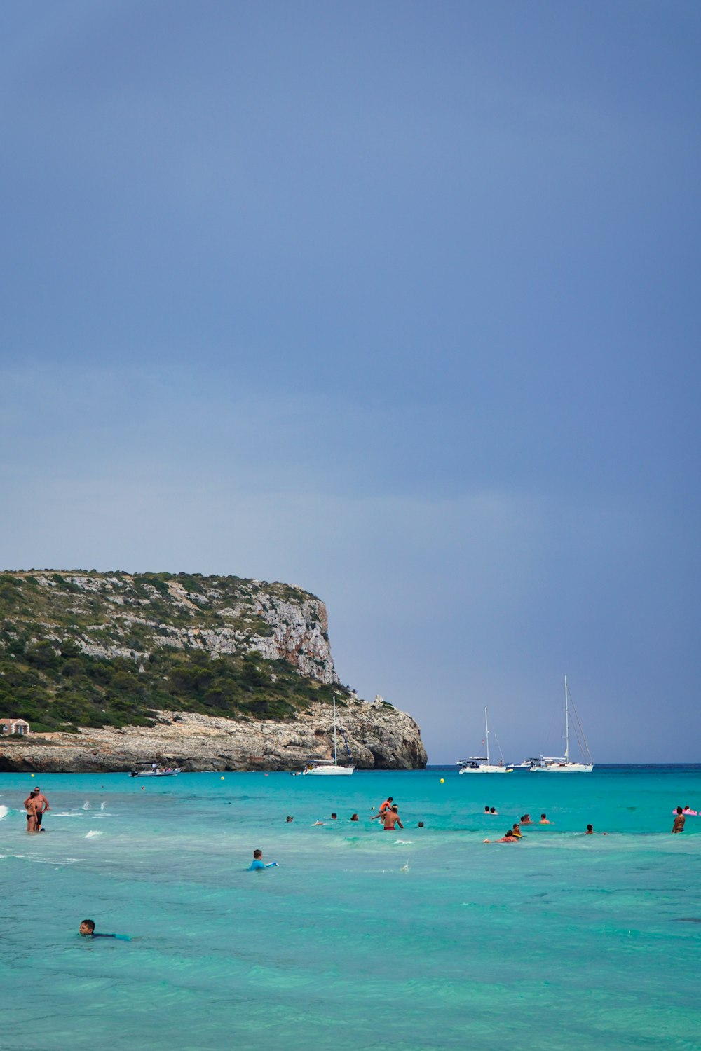 a group of people swimming in the ocean