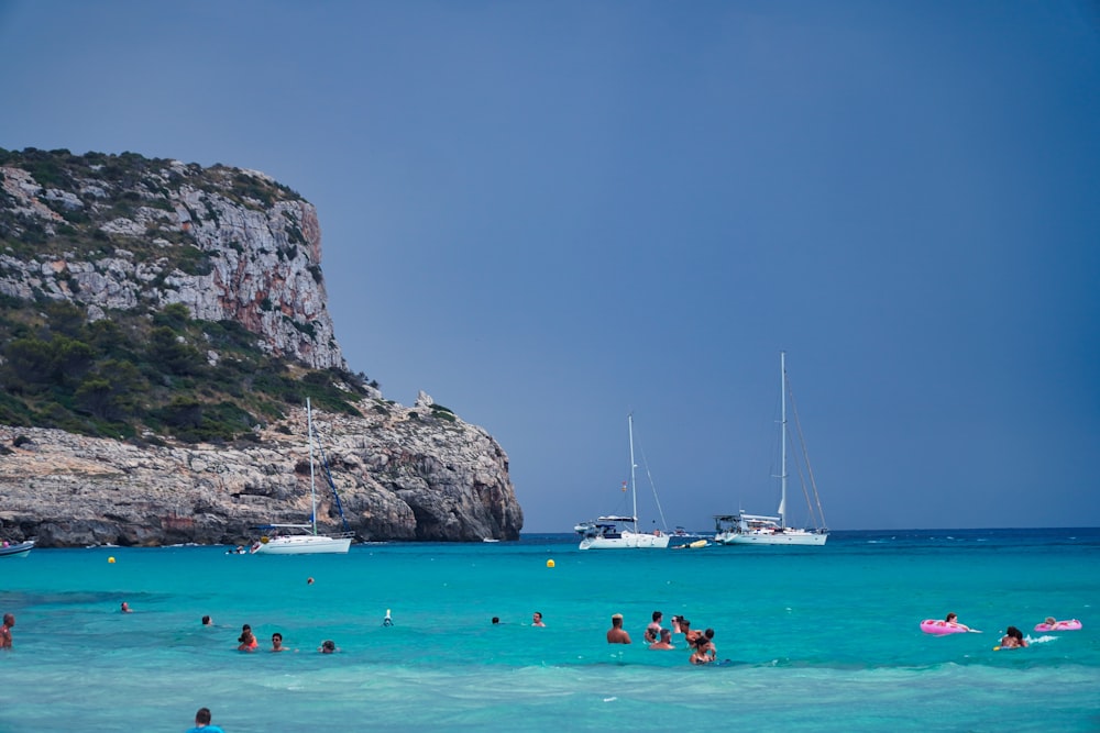 a group of people swimming in the ocean