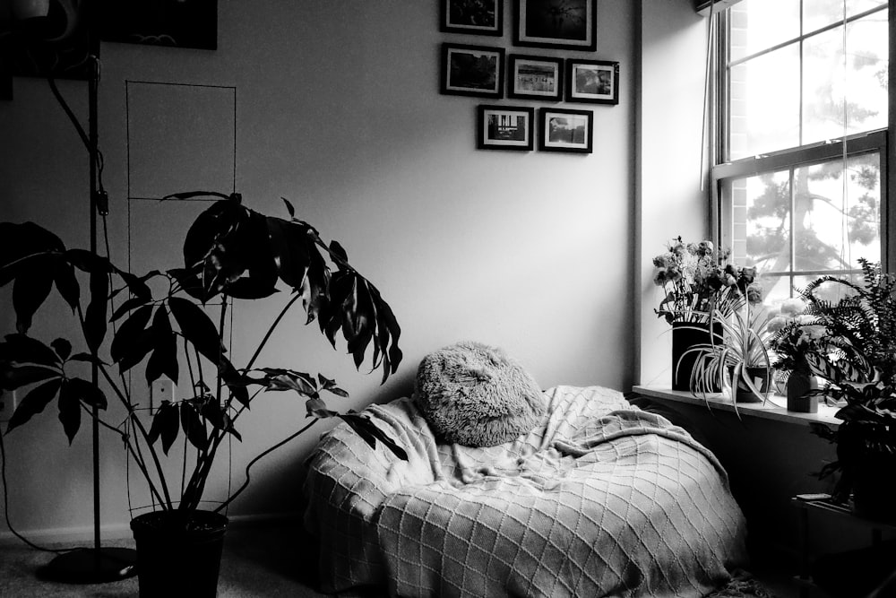a black and white photo of a person laying in a bed