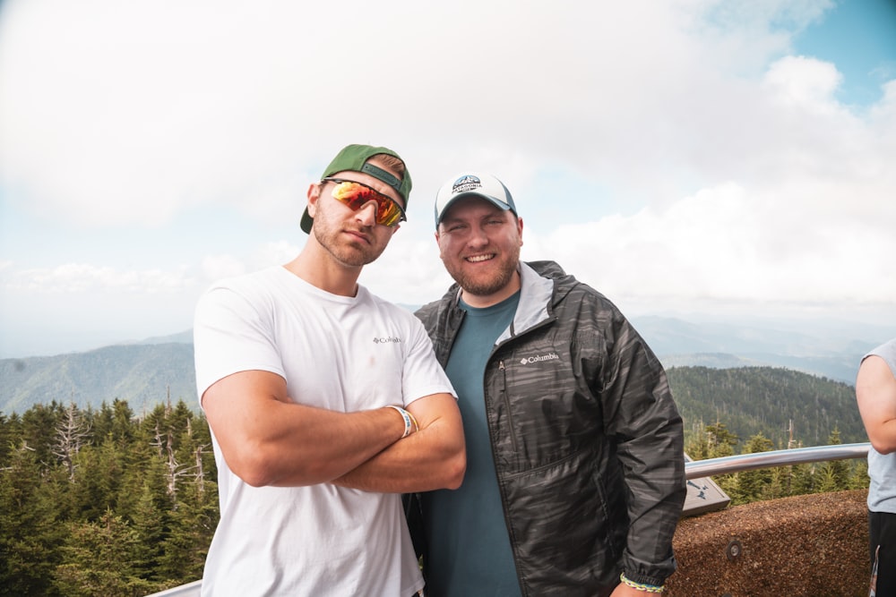 a couple of men standing next to each other