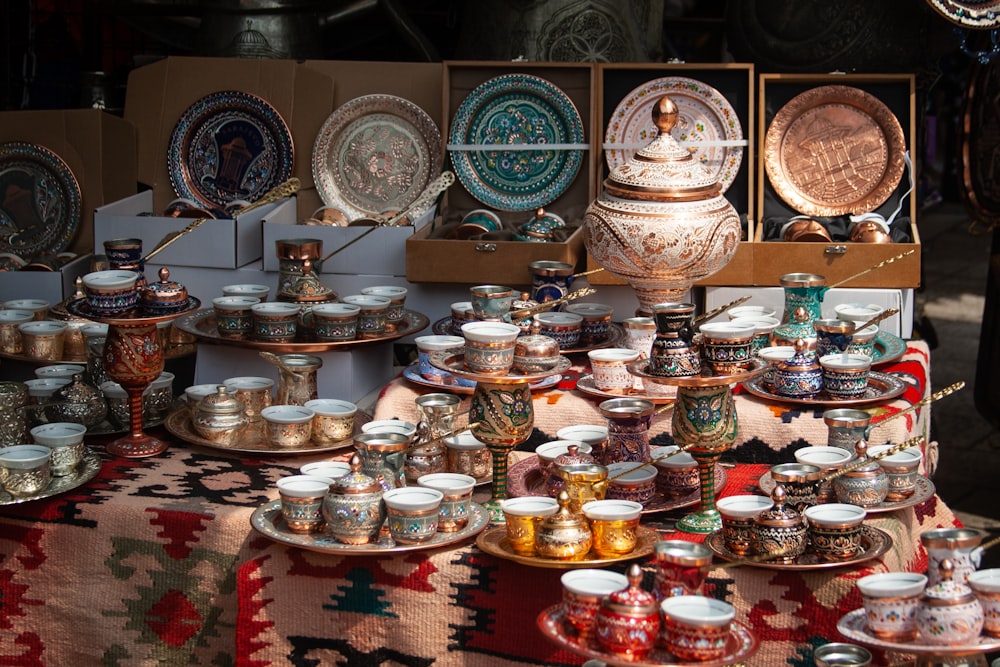 a table topped with lots of plates and bowls