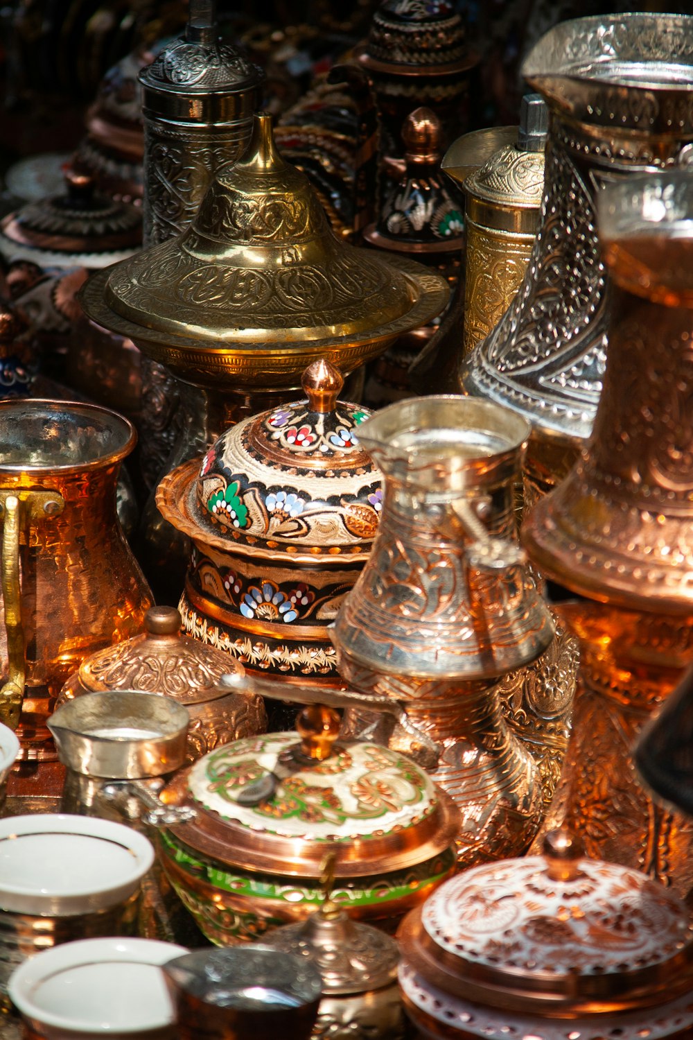 a table topped with lots of different types of vases