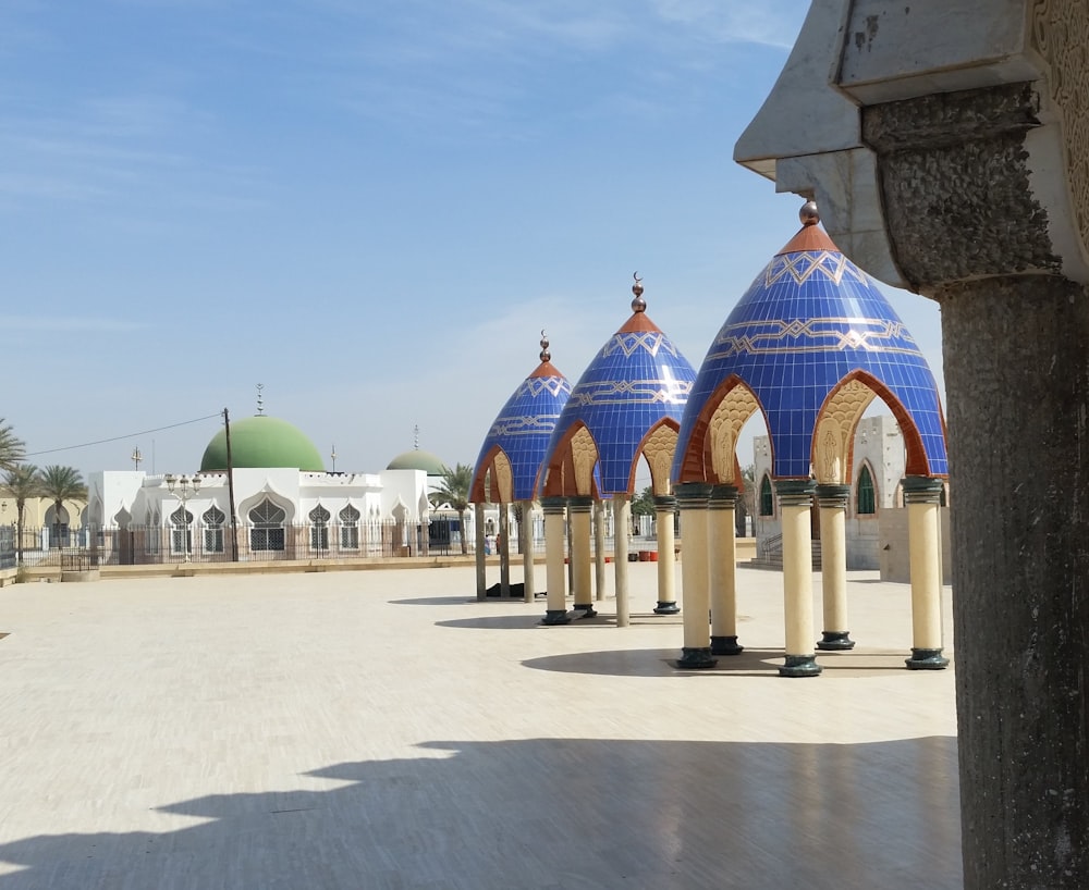 a row of blue and white domes in a courtyard