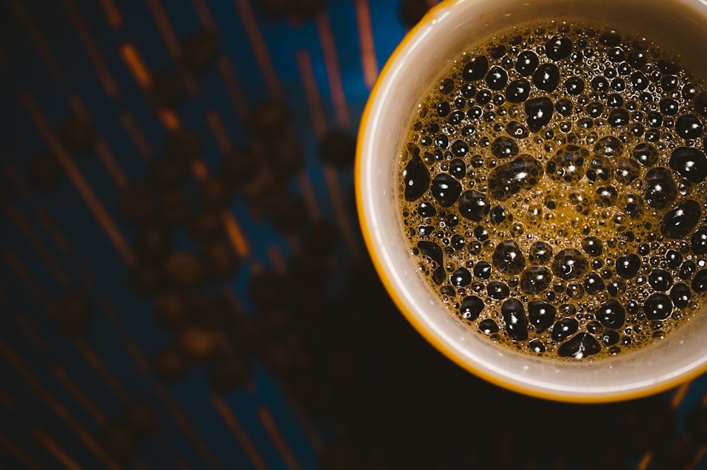 a cup filled with liquid sitting on top of a table