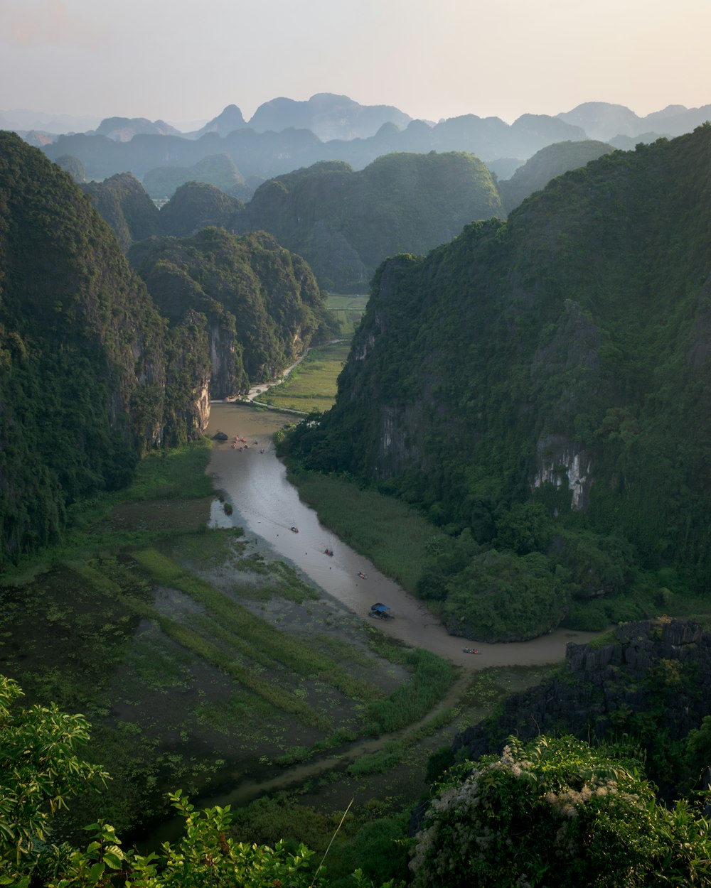 a river running through a lush green valley