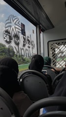 A modern bus crossing a state border with passengers inside.