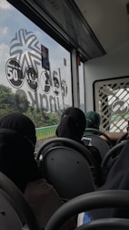 Colorful bus and airplane tickets being booked online on a smartphone screen.