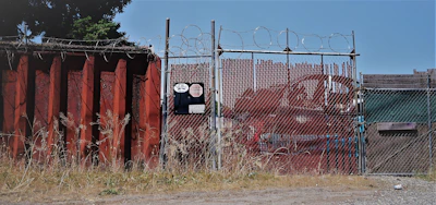 Durable PVC modular fencing installed around an industrial area.