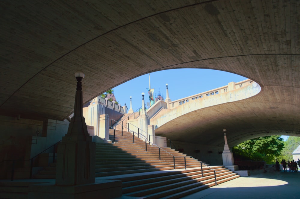 a view of a building from under a bridge