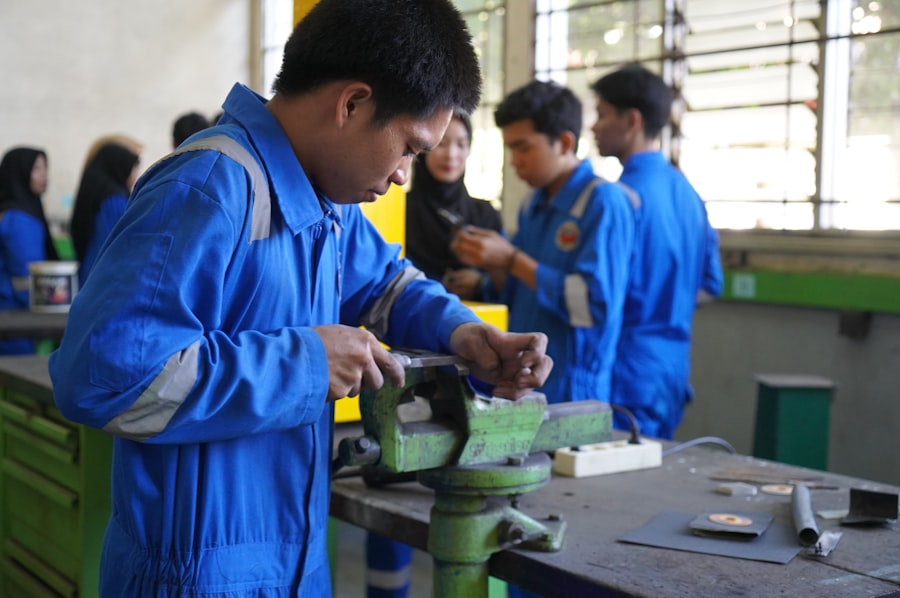 Engineering students working at a technical workshop bench