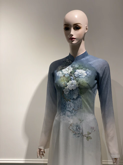 Elegant traditional clothing displayed on a mannequin against a dark cosmic gradient background