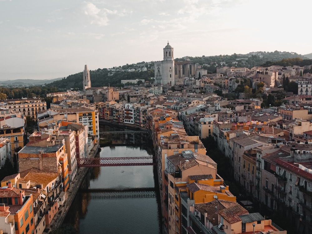 a river running through a city next to tall buildings