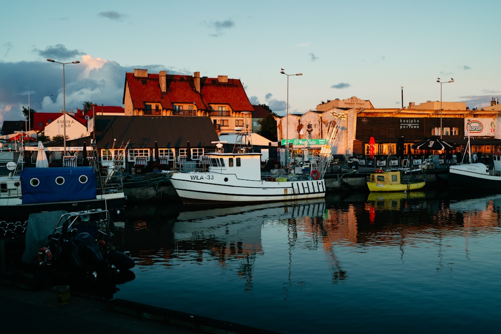 a group of boats that are sitting in the water