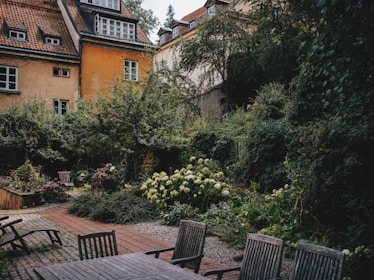 A serene hospital garden where volunteers and patients can relax.