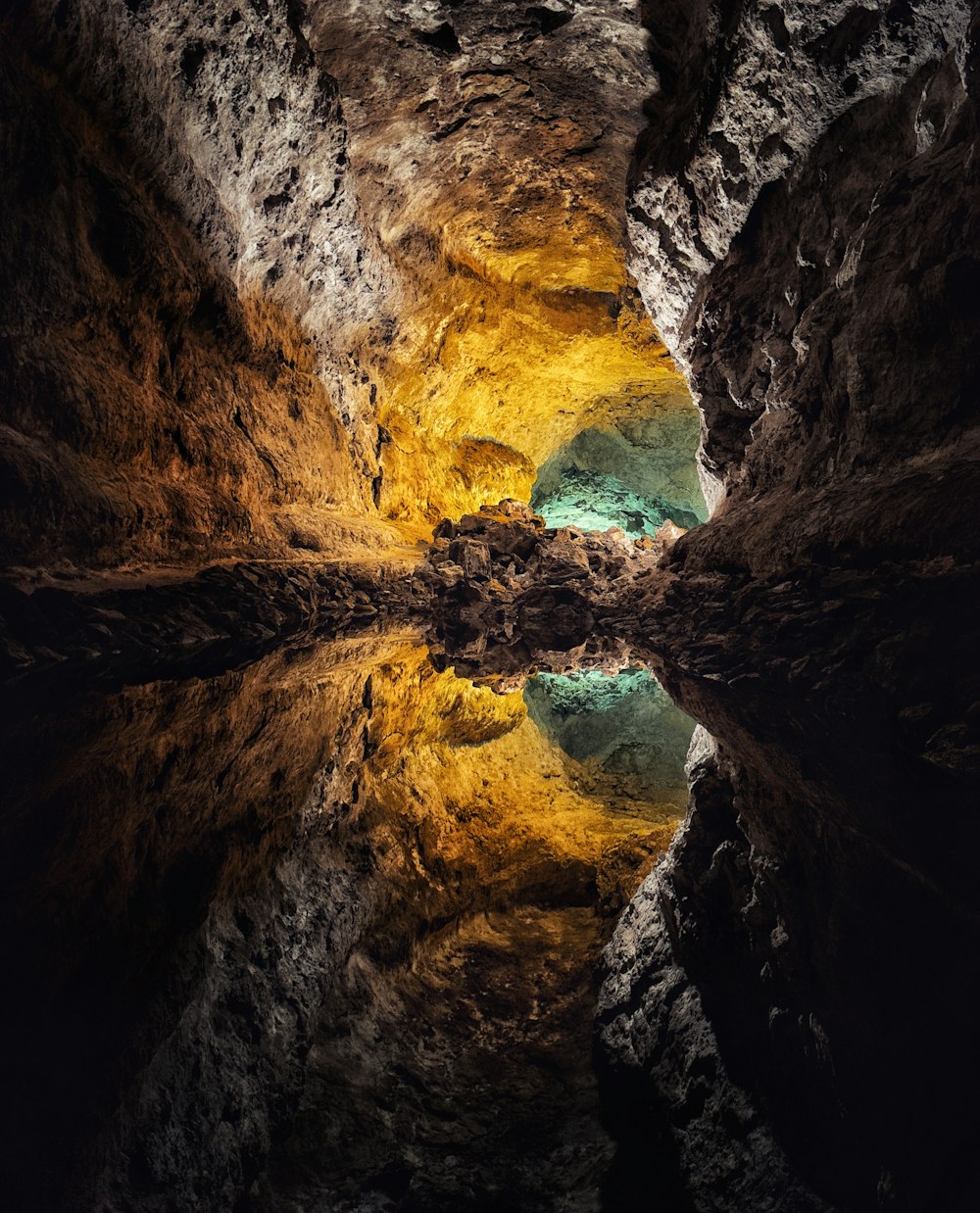 a cave filled with lots of water and rocks