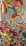 A vibrant collection of colorful spinning tops and lollipops featuring swirling patterns and a wide array of colors including red, blue, yellow, and green. The designs are intricate, with concentric circles and spiral motifs that give a playful and lively appearance to the scene.