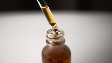 a bottle filled with liquid and a pipe sticking out of it