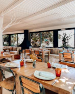 Cozy Scandinavian-style restaurant interior with artisanal dishes on the table