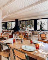 Cozy Scandinavian-style restaurant interior with artisanal dishes on the table