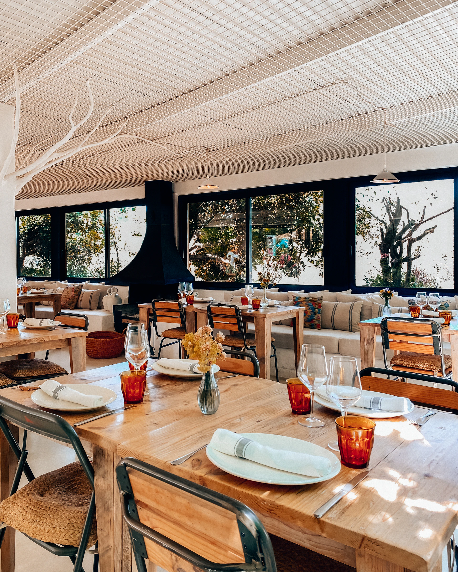 Cozy interior of Rasaka Nyala restaurant with warm lighting and elegant wooden furniture