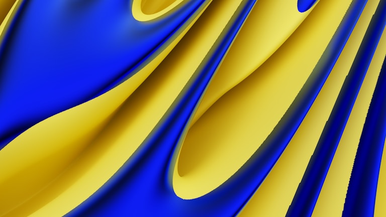 Curved, overlapping fabric-like surfaces in vivid blue and yellow form flowing, abstract shapes. The colors intertwine and blend seamlessly, evoking a sense of motion and fluidity.