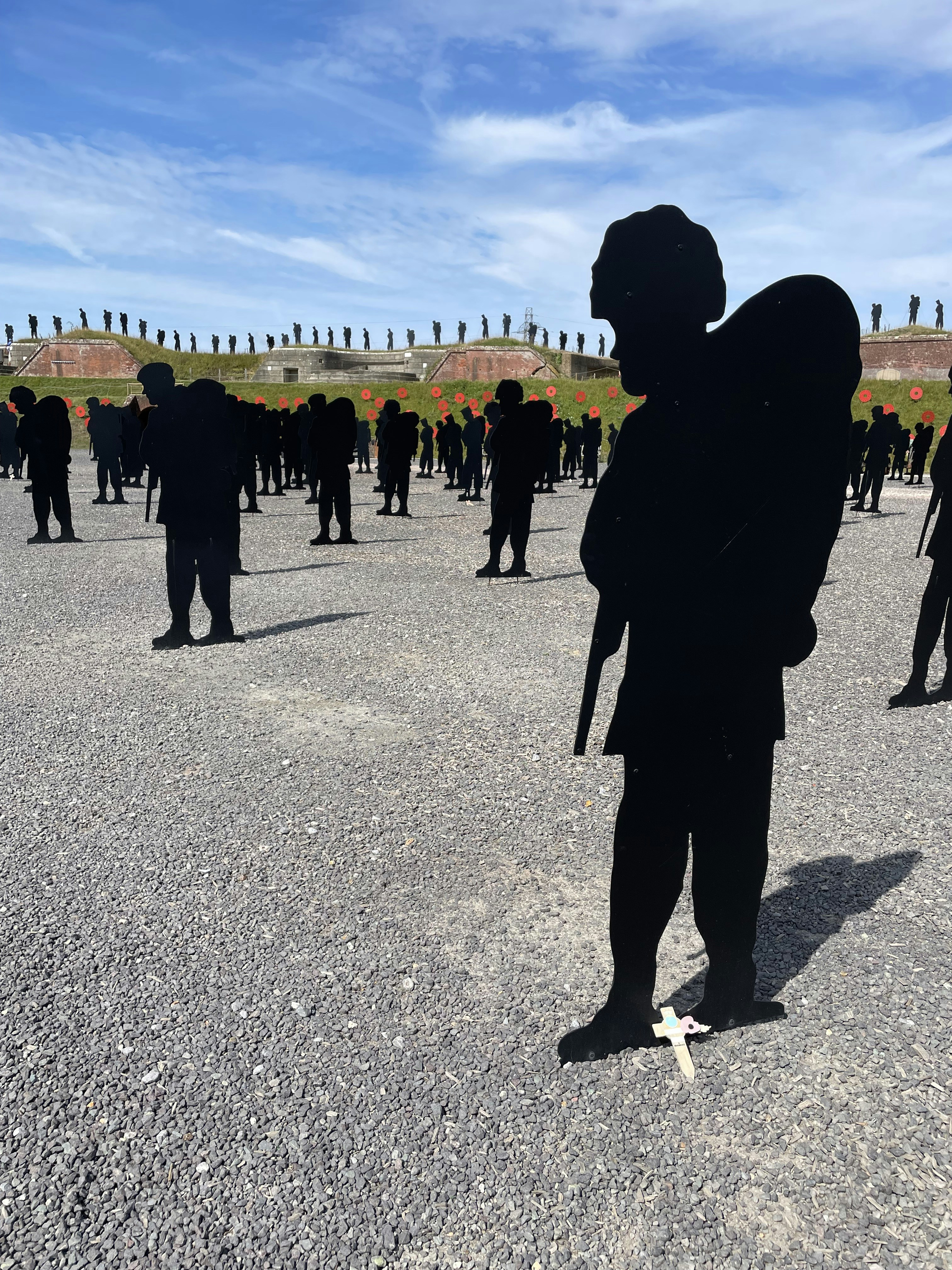 Soldiers in physical training, running in disciplined rows, morning light, military training ground, blue sky, authoritative