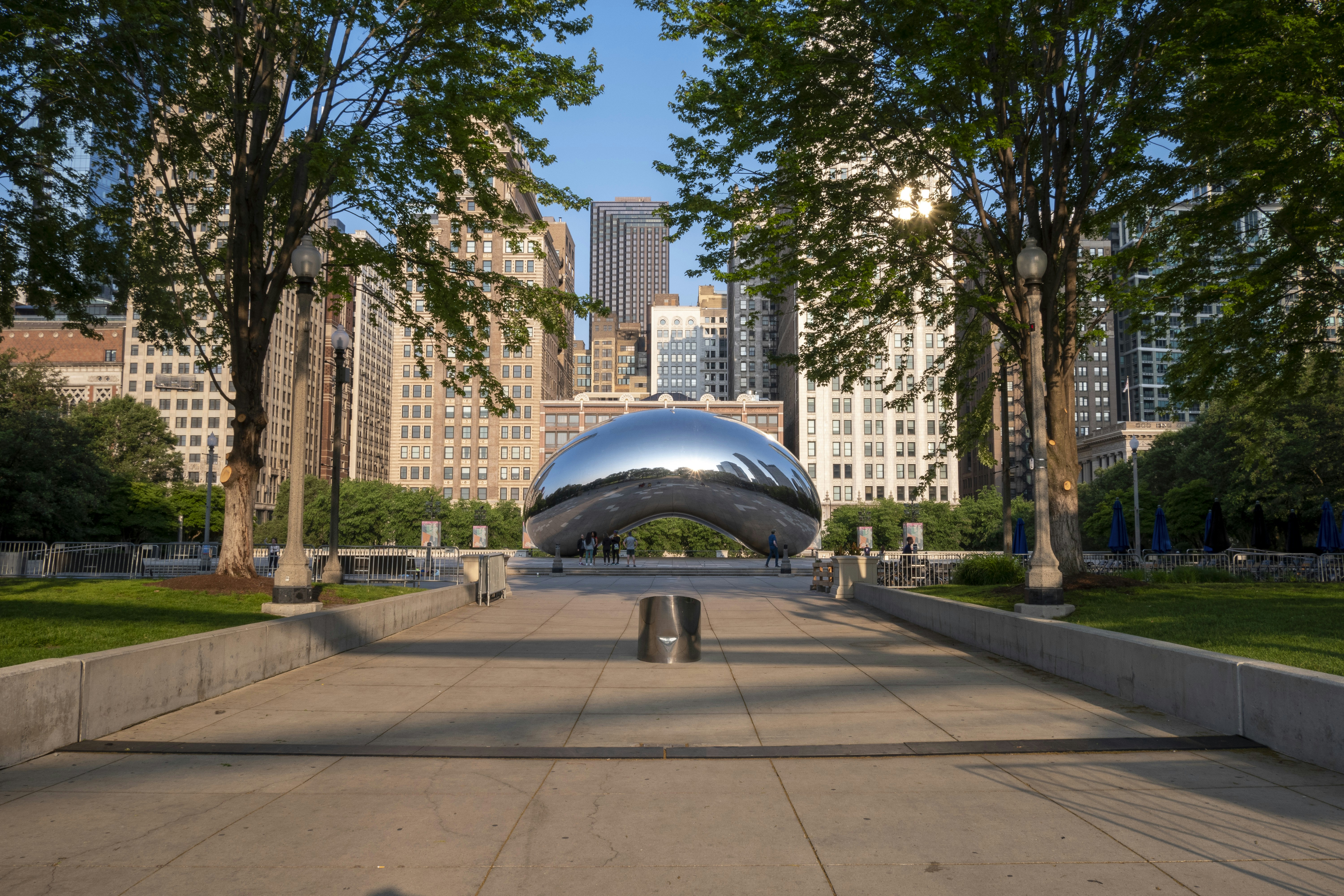 a large metal object sitting in the middle of a park