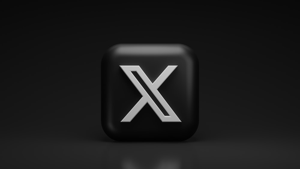 a black button with a white x on it