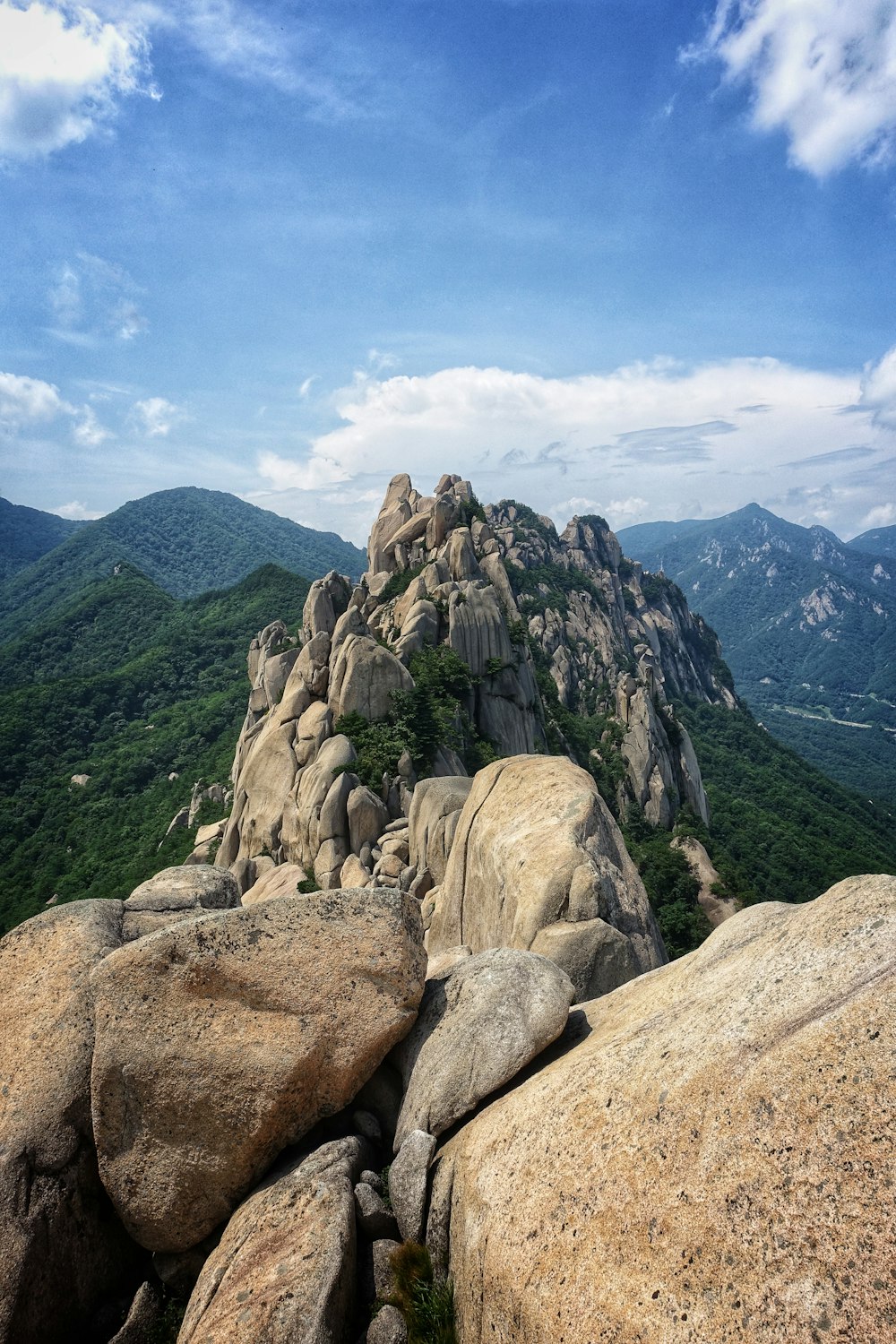 a view of a rocky mountain with a sky background