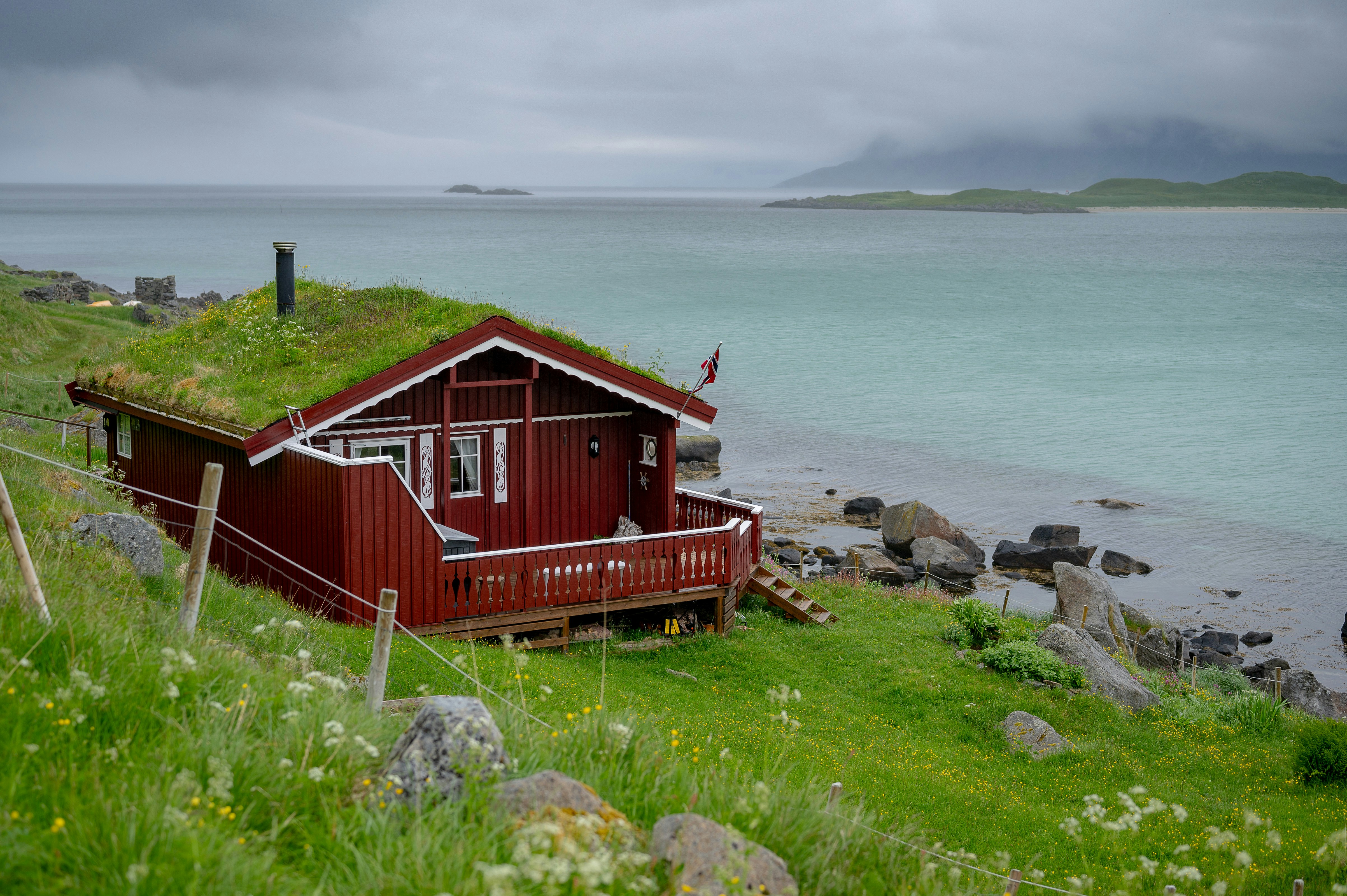 A red cabin by the sea