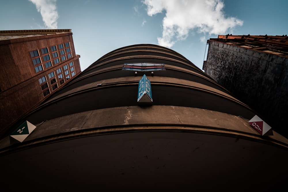 a blue surfboard sitting on the side of a building